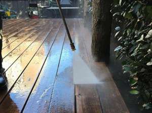 high pressure washing an outdoor deck