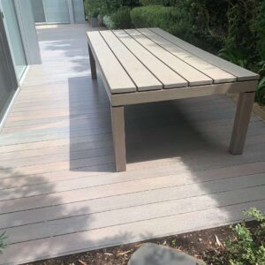 Weathered grey deck with same coloured outdoor furniture